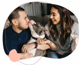 Friendly doggo kissing mans face.